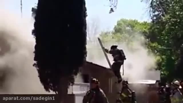Firefighter falls through burning roof in Fresno CA