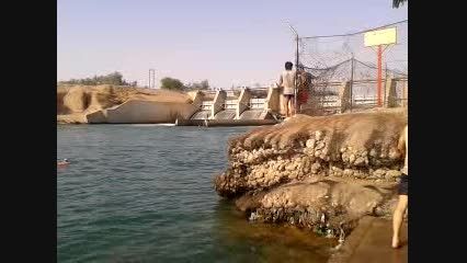 swimming in front of Dam