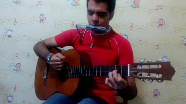 اجرای همزمان گیتار و هارمونیکا(سازدهنی)توسط محسن مهاجر