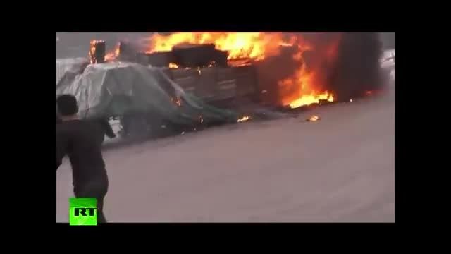 خروج یک ماشین سنگین هوو آتش گرفته از تونلی در چین