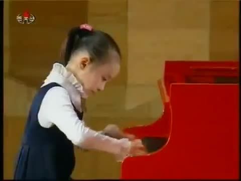 North Korean girl plays piano