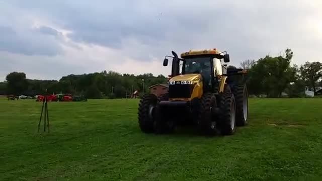 Cat tractor pulling a steam engine