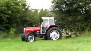 MF399 Cabbed Tractor Mowing Grass