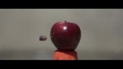 تیر خوردن یک سیب را باسرعت 60.000 فریم درثانیه ببینید