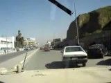 Hummer  driving  in  traffic  in  Baghdad