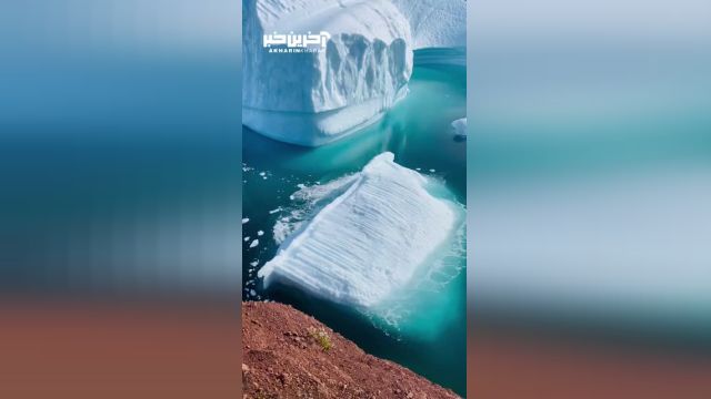 لحظه واژگونی کوه یخ در آب های گرینلند