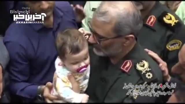 تصویری احساسی از نوزاد 9 ماهه شهید فراجا در آغوش سردار رضایی